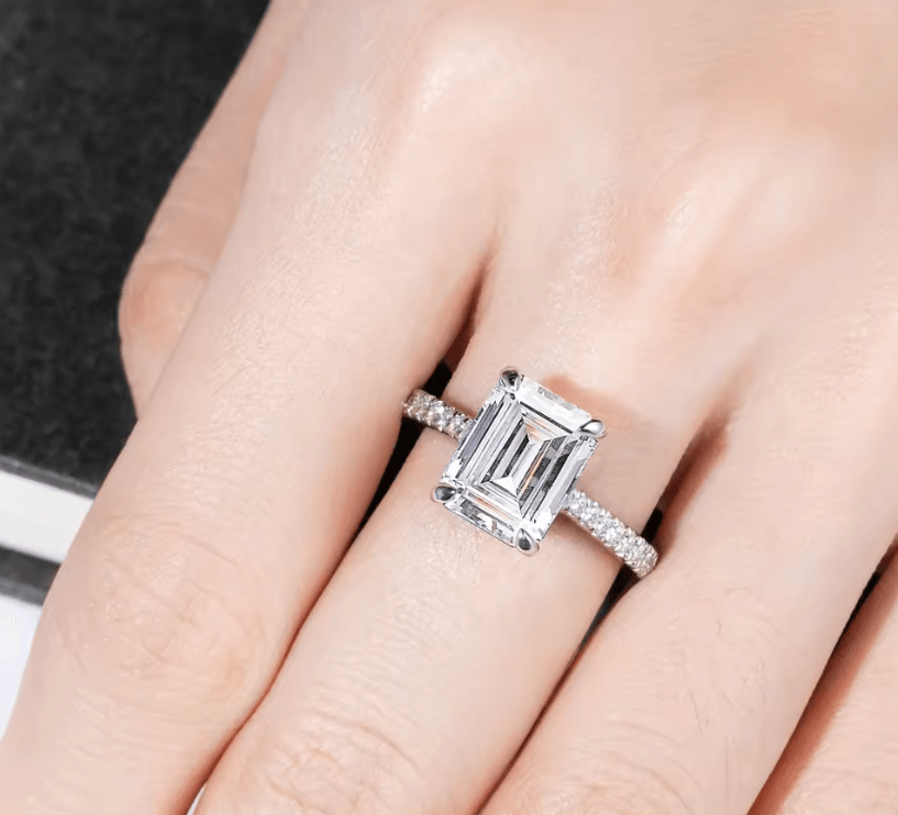 Moissanite solitaire pave engagement ring, emerald or radiant cut moissanite diamond with D color and VVS clarity, made for women by russmoon, being worn on hand