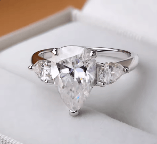 Waterdrop moissanite engagement ring with 925 sterling silver, one main stone with 2 side stones, sparking moissanite